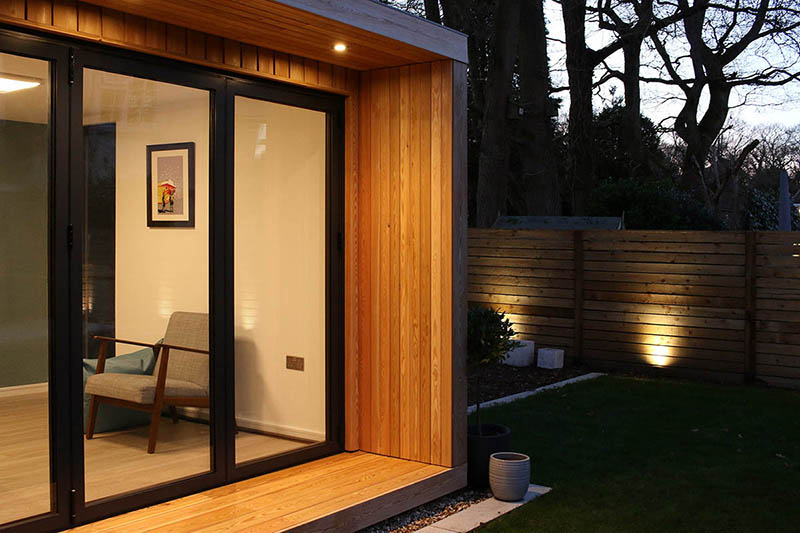Garden room with Siberian larch cladding and canopy